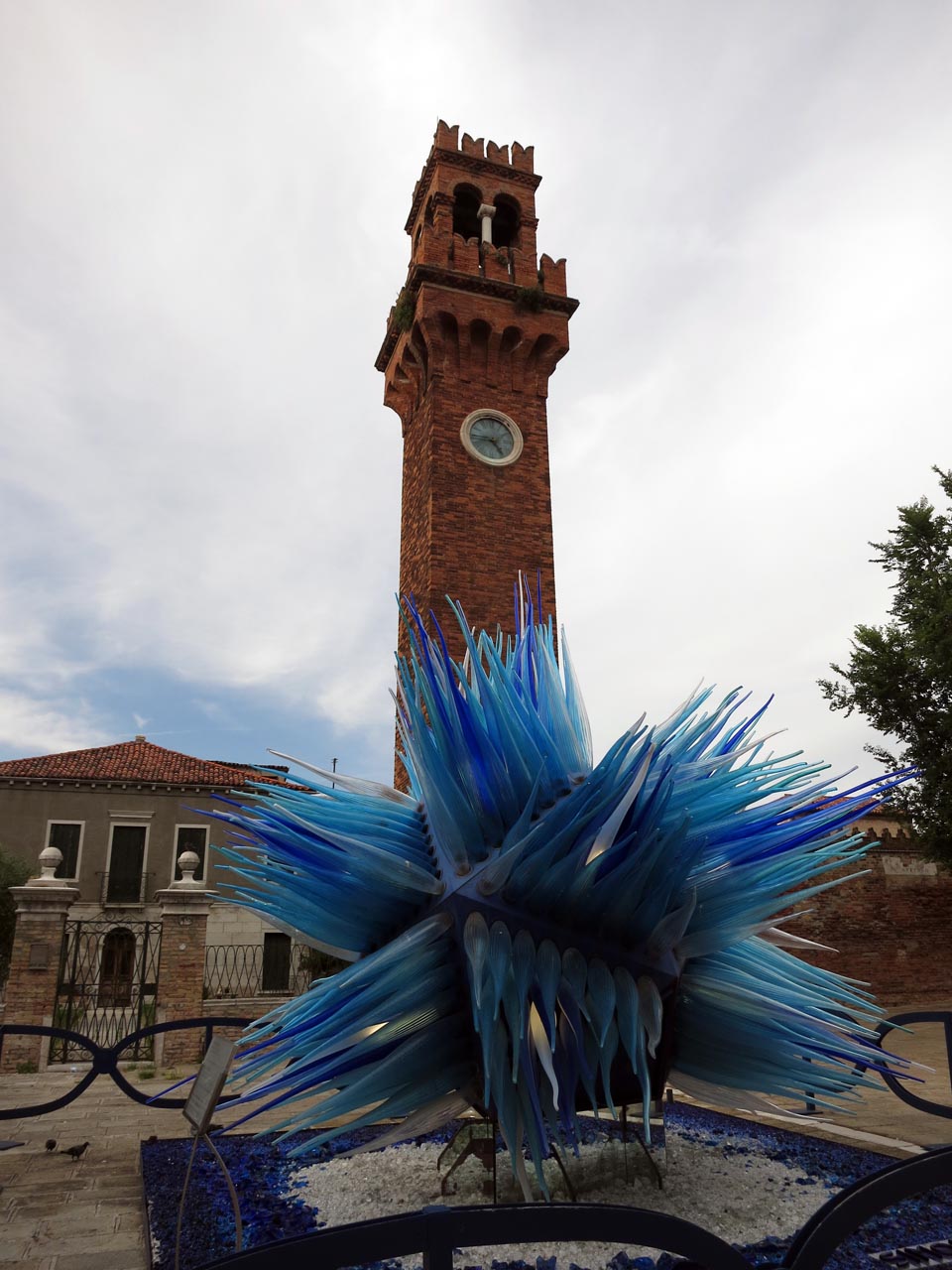 Glass sculpture in front of tower - Murano